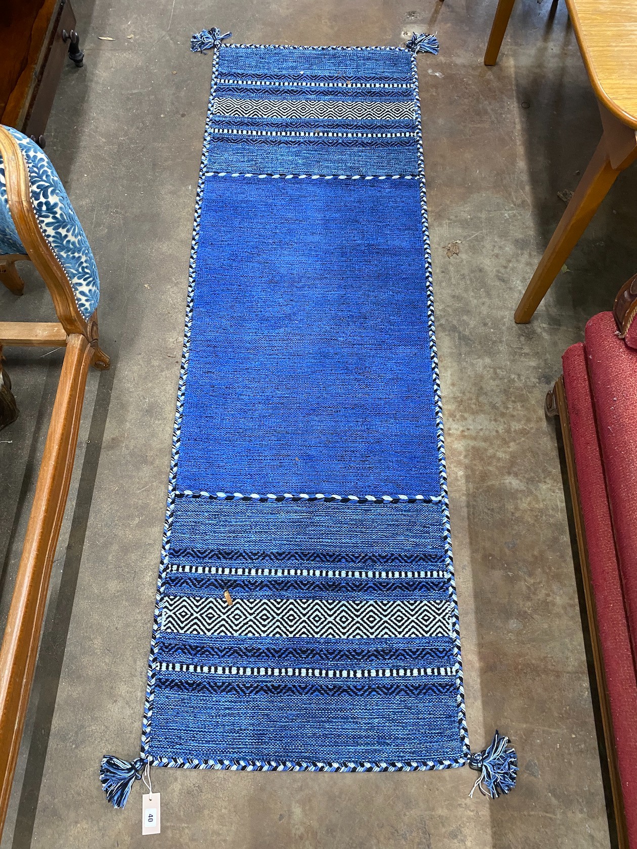 A contemporary flat weave runner 220cm x 70cm